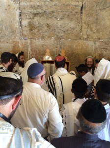 crowding around the scrolls of Scripture